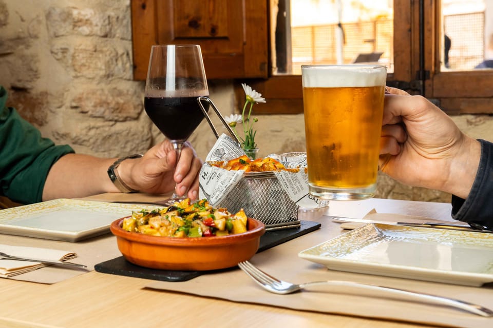 Alcudia: Self-Guided Gourmet Tapas and Wine Tour - The four-stop format: tapas plus a drink, every time