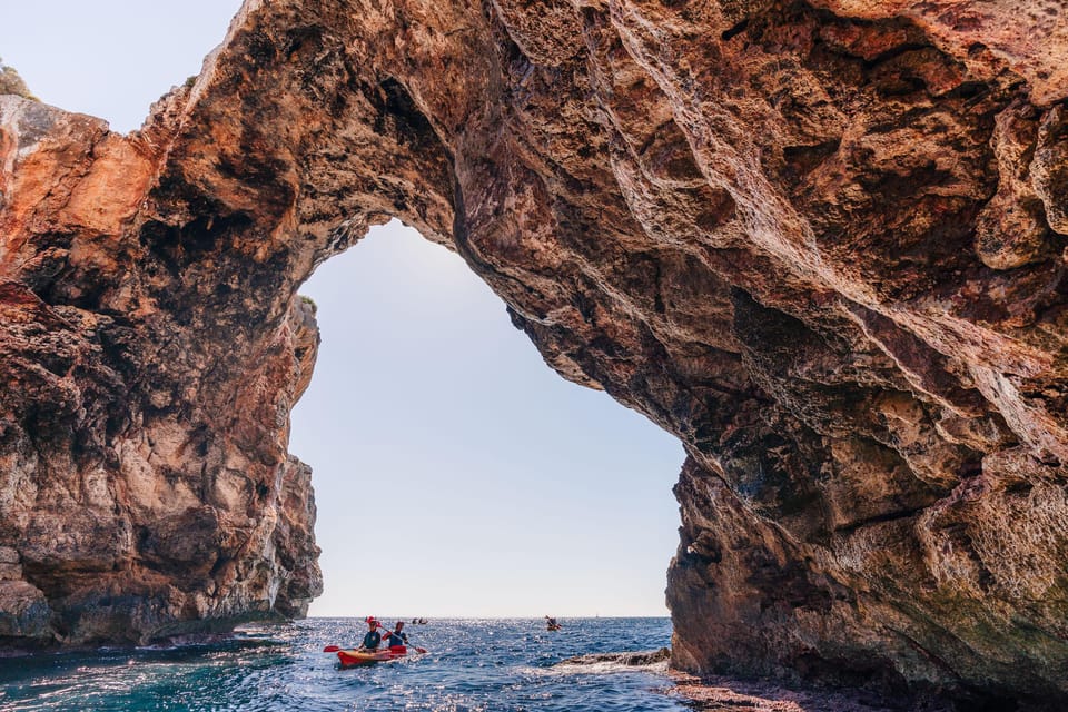 Cala Varques: Guided Sea Caves Kayak & Snorkeling Expedition - Kayak-to-cave scenery off Cala Romantica