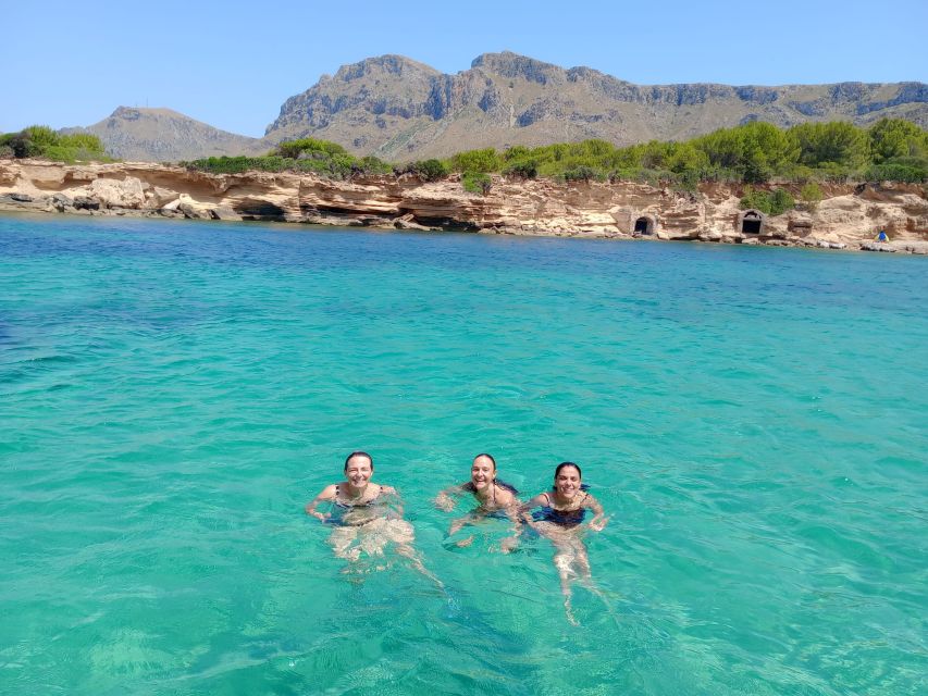 Can Picafort: Dolphin Watching Boat Tour with Swimming - The return route: cave and cove time that actually feels scenic