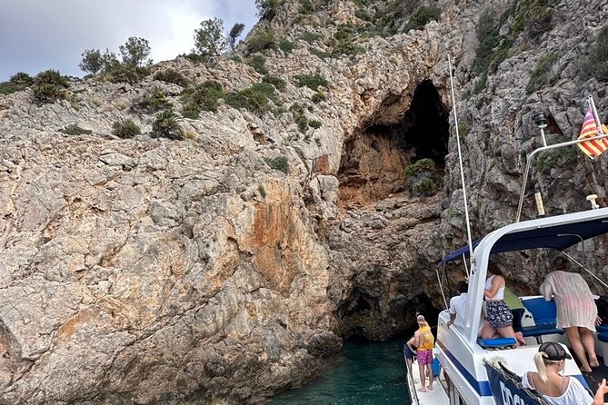 Mallorca Beach & Caves 4hr Boat Trip Drinks, Tapas, SUP & Snorkel - Alcanada Island and the lighthouse area: final swim, snacks, and sun time