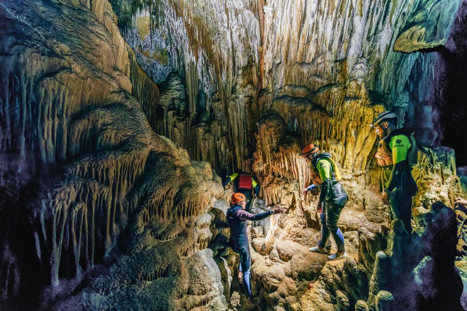 Mallorca: Cova des Coloms Caving Trip with Hotel Transfer - Inside Cova des Coloms: formations, scrambling, and natural cave lakes