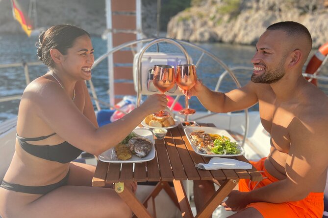 Mallorca sailing tour with tapas and wine - Steering the Yacht by Dolphin Odds in Pollença’s Bay