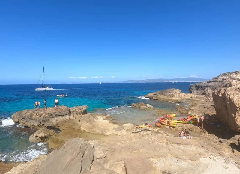 Mallorca: Sea Cave Kayaking Tour with Snorkeling and a Snack - Paddling Past Cliffs, Photos, and Sea Cave Stops