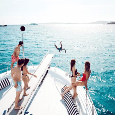 Palma Bay: Boat Tour with BBQ, Snorkelling, & Sunset Option - The onboard vibe on Super Delfin Verde: music, photos, and a friendly crew
