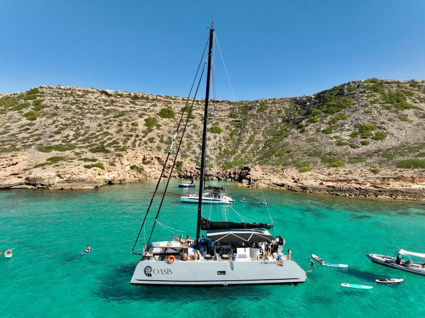 Palma: Cueva Verde and Cala Vella Catamaran Cruise with BBQ - Cala Vella Marine Reserve: Paddle Boards, Snorkeling, and Safety Support