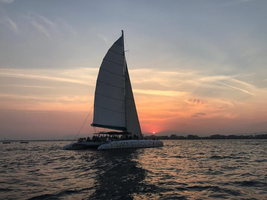 Palma de Mallorca: Sunset Sailing Catamaran Trip with Drink - Music, Dancing, and the Onboard Atmosphere
